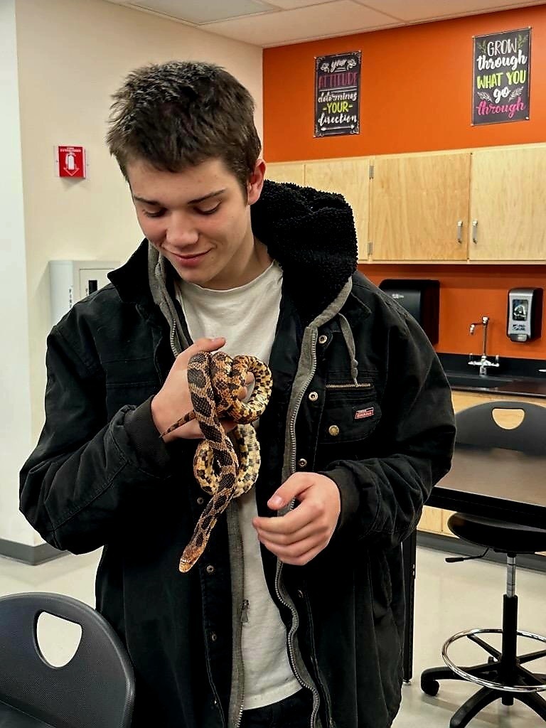 student with snake